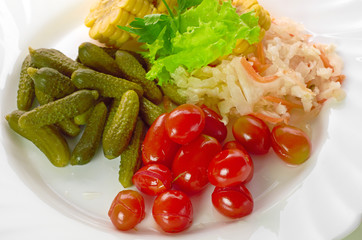pickled vegetables of tomato, cucumber, cabbage isolated