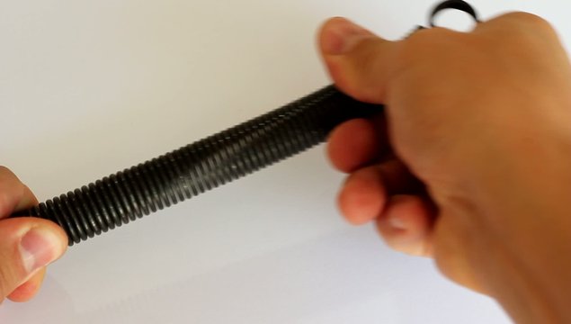 man stretches his arms spring