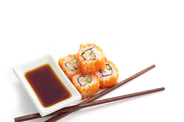 Sushi with chopsticks isolated over white background