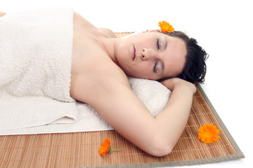 Obraz na płótnie Canvas attractive woman with hot stones treatment at a spa