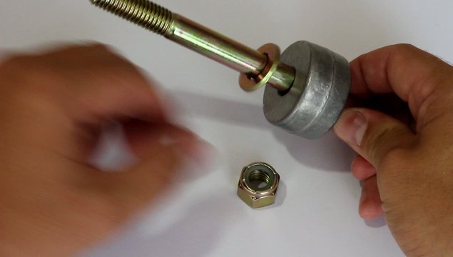 Large bolt and tighten the nut by hand