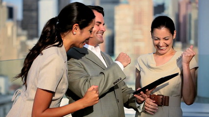 Teamwork of diverse colleagues investing online on tablet ending handshake  - Powered by Adobe