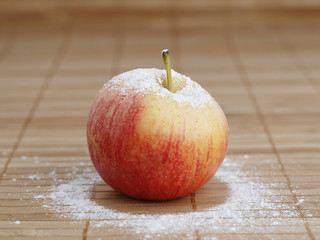 An apple with flour on top
