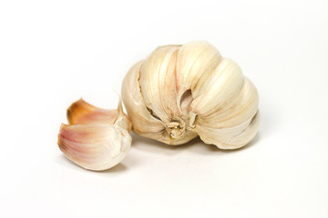 Natural-looking garlic isolated on white background