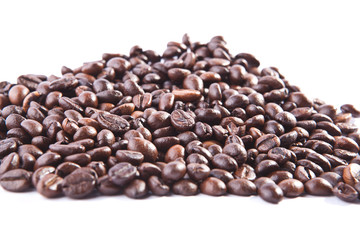 Heap of coffee beans. Isolated on white background