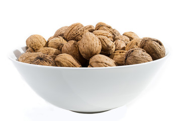 bowl with walnuts on white