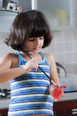 girl painting the martorana fruit