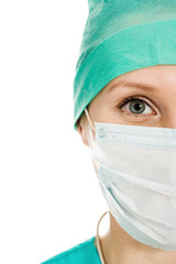Surgeon woman in protective mask