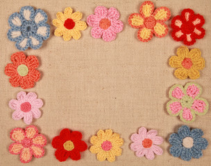 frame of knitted flowers