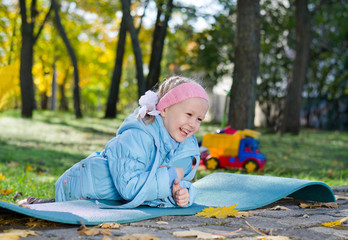 Laughing little girl playing in the park