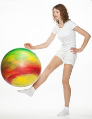 Young woman with gymnastic ball