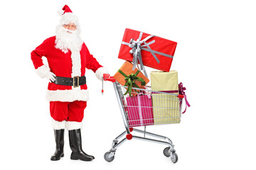Santa Claus pushing a shopping cart full of gifts