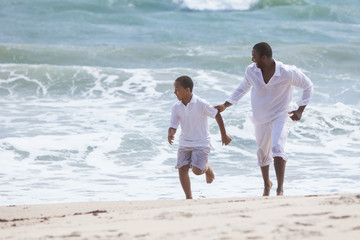 African American Father Son Family Running on Beach