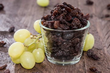 Glass filled with Raisins (and Grapes)