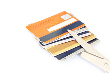 credit cards and scissors on white background