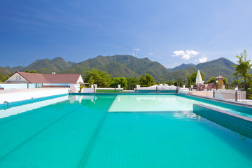swimming pool besides mountains