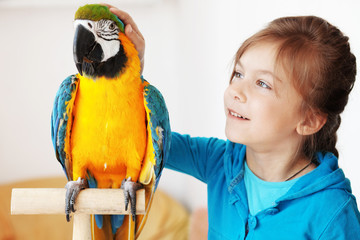 Child with ara parrot © Alena Ozerova