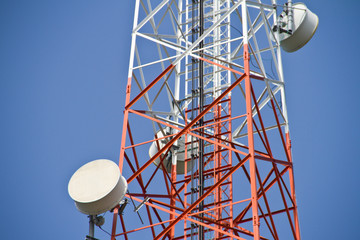 Mobile tower communication antennas with blue sky background