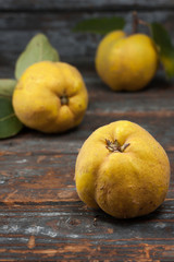 Quince on wooden table, close up