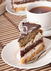 Close up of homemade chocolate cake in white plate. 