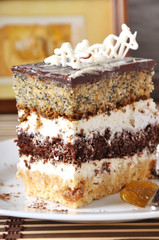 Close up of homemade chocolate cake in white plate. 