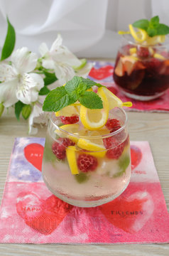 Fresh homemade lemonade with mint and raspberries