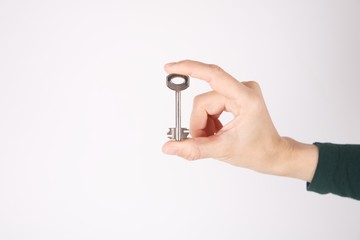 isolated retro key in woman fingers