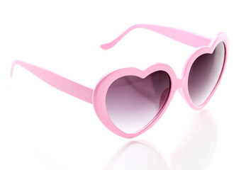 Pink heart-shaped sunglasses isolated on white