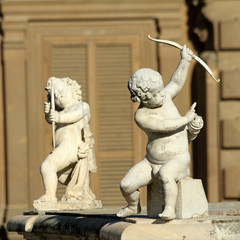 Two Cupids with bow, sculptures  from Boboli Gardens in Florence