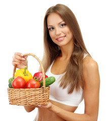 beautiful young woman with vegetables in basket, isolated