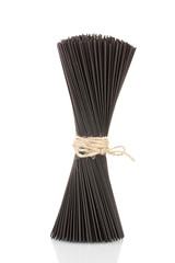 Black  spaghetti isolated on white