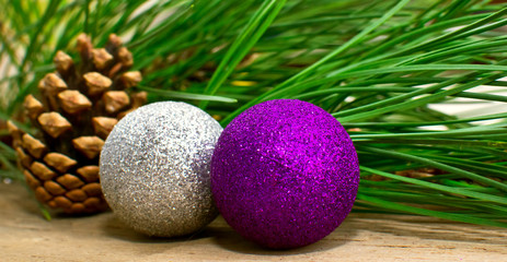 Christmas fir tree with decoration on a wooden board