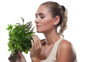 woman with a bundle of fresh mint