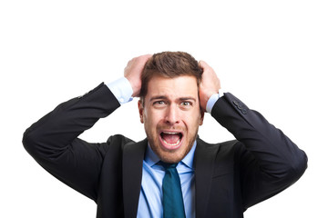 Angry businessman with hands in his hair