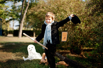 the nature boy in black hat and coat celebrates Halloween