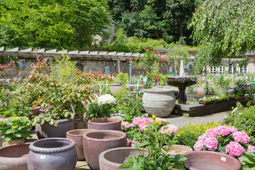 Garden center with big stone flower pots