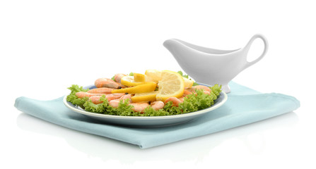 Boiled shrimps with lemon and lettuce leaves