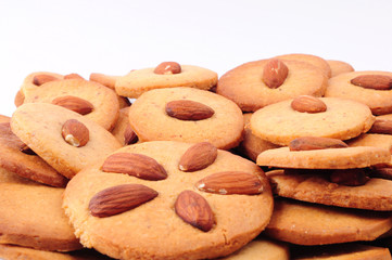 Naklejka premium Pile of almond cookies on white background