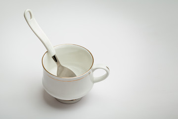 White cup and spoon