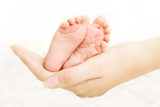 Baby legs in mother hands