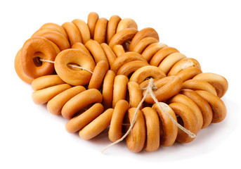 tasty bagels on rope, isolated on white