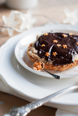 Christmas Tartlet with Chocolate, Cream, Small Gold Stars