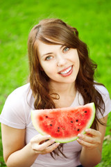 Woman with juicy watermelon in hands