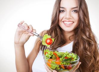 happy healthy woman with salad on fork