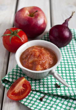 Red spicy sauce with apples and tomatoes