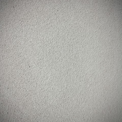 grey concrete wall texture background with dark vignette