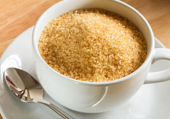 raw brown sugar in the coffee cup close up shot