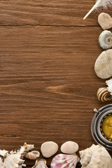 seashell and compass on wood