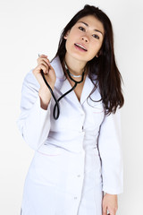 Doctor woman with arms crossed against white background.