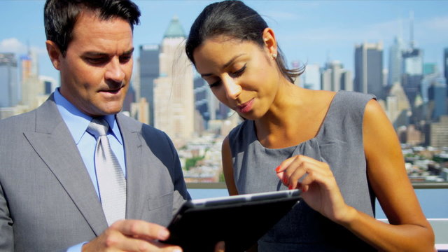 Handshake of multi ethnic business team closing contract using touch screen